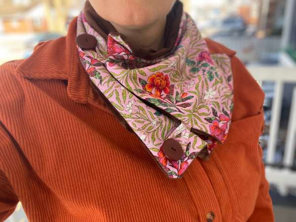 Photo of a short scarf with button closure and minky fleece lining