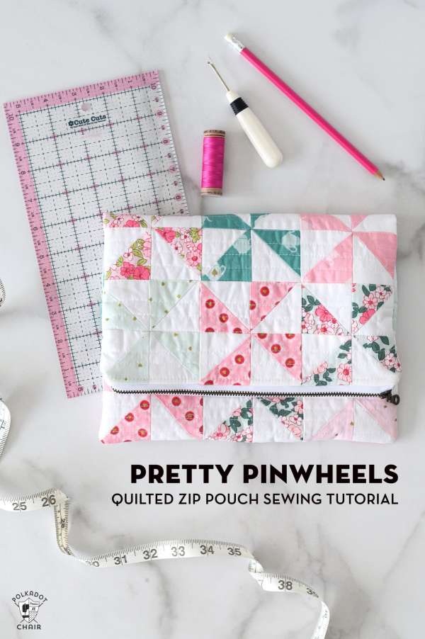 photo of a fold over zipper pouch made from patchwork pinwheel blocks